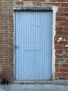 Old blue metal door. Royalty Free Stock Photo