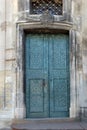 Old blue metal forged door in a stone building Royalty Free Stock Photo