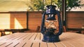 Old blue oil lamp on a wooden table Royalty Free Stock Photo