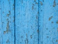 old blue paint on a wooden wall texture. Aged painted cracked boards with blue color peeling paint. Old natural grunge textured Royalty Free Stock Photo