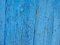old blue paint on a wooden wall texture. Aged painted cracked boards with blue color peeling paint. Old natural grunge textured Royalty Free Stock Photo