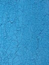 Old blue paint on a wooden wall texture. Aged painted cracked boards with blue color peeling paint. Old natural grunge textured Royalty Free Stock Photo