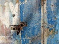 Old blue painted door with lock in the habor of Procida Italy Royalty Free Stock Photo