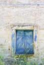 Old blue painted window on grunge wall Royalty Free Stock Photo