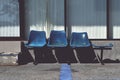 Old blue plastic chairs for service recipients