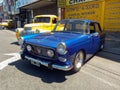 Old blue popular Peugeot 404 sedan 1960 - 1975 in the street. Expo Warnes 2022 classic car show.