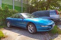 Old rare blue Ford Probe parked in summer July light