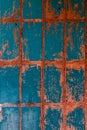 Old blue-red tile on the wall, rustic background Royalty Free Stock Photo