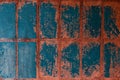 Old blue-red tile on the wall, rustic background Royalty Free Stock Photo