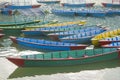 A old blue red yellow green wooden boats on the water. colorful boats without people Royalty Free Stock Photo