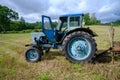 Old blue Russian agricultural tractors in the field. Agricultural machinery in the farm. Special Agricultural Equipment Royalty Free Stock Photo