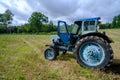 Old blue Russian agricultural tractors in the field. Agricultural machinery in the farm. Special Agricultural Equipment Royalty Free Stock Photo