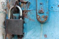 Old blue rustic door with rusty lock and keyhole Royalty Free Stock Photo