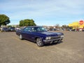 old blue 1960s Chevrolet Impala SS 327 Super Sport coupe by GM in a parking lot. Classic car show Royalty Free Stock Photo