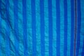 old blue shading net with sun light in outdoor market texture an Royalty Free Stock Photo