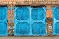 Blue large garage door made of bricks Royalty Free Stock Photo