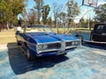 Old blue sport 1969 Pontiac GTO convertible in a park Royalty Free Stock Photo