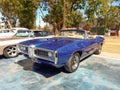 Old blue sport 1969 Pontiac GTO convertible in a park Royalty Free Stock Photo