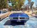 Old blue sport 1969 Pontiac GTO convertible in a park Royalty Free Stock Photo