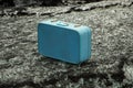 Old blue suitcase on a rock Royalty Free Stock Photo