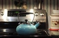 Old Blue Tea Kettle on Stove Ready for Use Royalty Free Stock Photo