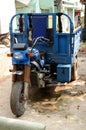 Old blue tricycle cargo bike on the street of Tangier.