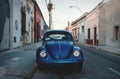Old blue Volkswagen beetle in the colonial streets of Merida, Yucatan, Mexico