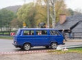 Old blue VW Transporter van driving Royalty Free Stock Photo