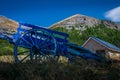 Old blue wagon or cart in a field with the French alps in the background , Lus la croix haute ,France , holiday destination Royalty Free Stock Photo