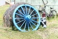 Old blue wagon wheel decoration the silent backyard Royalty Free Stock Photo