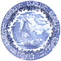 Blue and white ceramic plates with traditional Dutch landscape, canals, boats, windmills, isolated