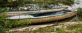 Old blue wooden abandoned fishing boat sunk on the shore of a river. Boat full of water Royalty Free Stock Photo