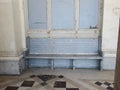 Old blue wooden bench in a corridor of a gallery Royalty Free Stock Photo