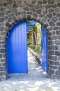Old Blue Wooden Garden Door On Stone Wall