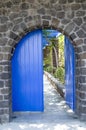 Old Blue Wooden Garden Door On Stone Wall