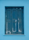 Old blue wooden window in Greece