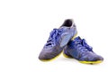 Old blue worn out futsal sports shoes on white background soccer sportware object isolated Royalty Free Stock Photo