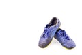 Old blue worn out futsal sports shoes on white background soccer sportware object isolated Royalty Free Stock Photo