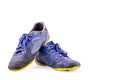 Old blue worn out futsal sports shoes on white background soccer sportware object isolated Royalty Free Stock Photo