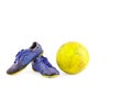 Old blue worn out futsal sports shoes and yellow futsal ball on white background football object isolated Royalty Free Stock Photo