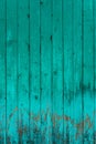 Old boards with cracked cyan paint. Textured wooden old background with vertical lines. Wooden planks close up for your