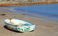Old boat abandoned on a beach.