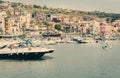 Old boat in Acitrezza harbor with fisher boats next to Cyclops islands, Catania, Sicily, Italy Royalty Free Stock Photo