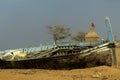 Old Boat besides a temple at  Kutchh , India Royalty Free Stock Photo