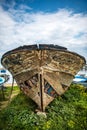 Old boat buried in green grass in Turkey Royalty Free Stock Photo