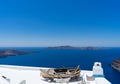 Old boat for decoration on a white roof. Santorini island, Greece