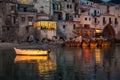 Old boat drifting in Cefalu harbor at dusk Royalty Free Stock Photo