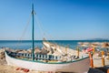 Old boat on empty seaside beach