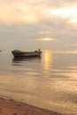Old boat in front of sunset background Royalty Free Stock Photo