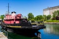 Old boat and grain silos in Old-Port of Montreal Royalty Free Stock Photo